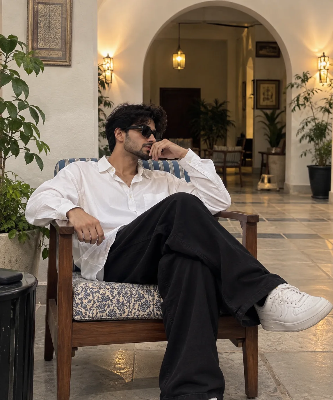 Ultra realistic cinematic portrait of a young man sitting in a wooden chair