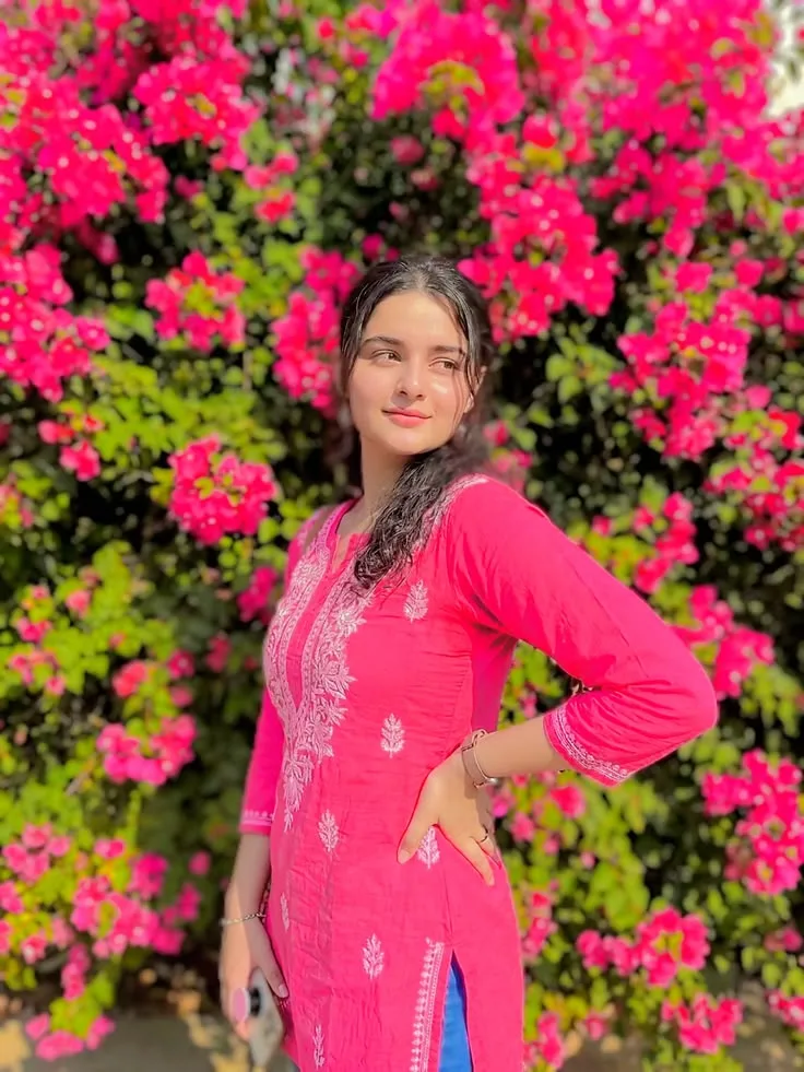 Vibrant Outdoor Female Portrait against Blooming Pink Bougainvillea Prompt