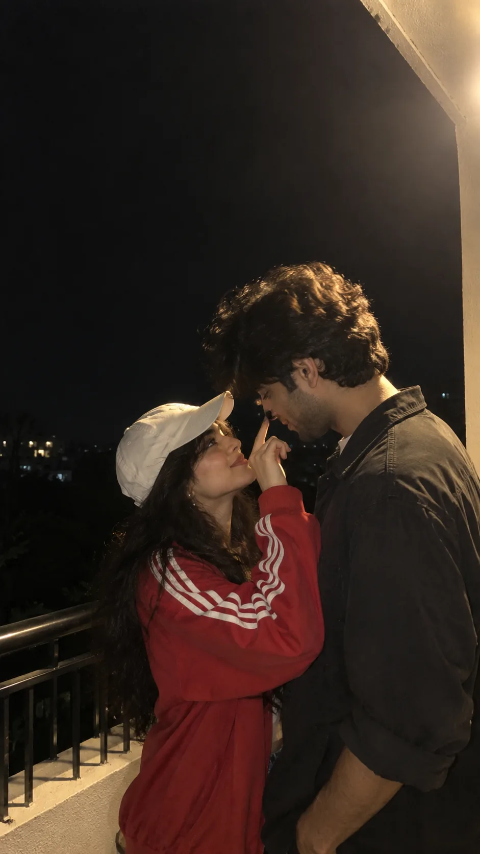 Ultra realistic candid night time photograph of a young couple