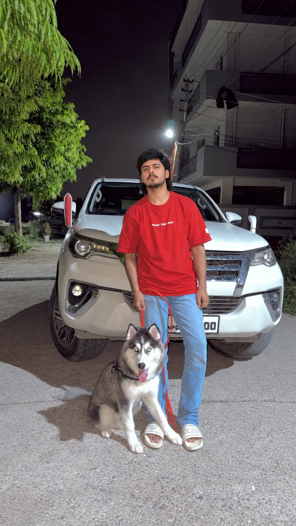 Nighttime Street Portrait with Husky & Luxury SUV