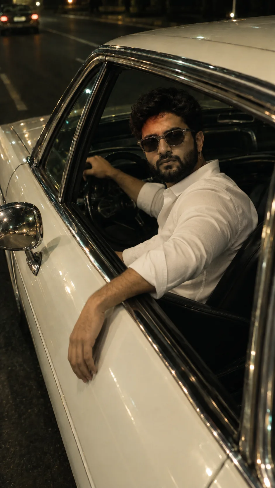 Stylish Man Driving a Vintage Car at Night