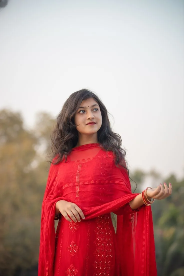 Candid Outdoor Portrait of Young Indian Woman in Crimson Red Salwar Suit
