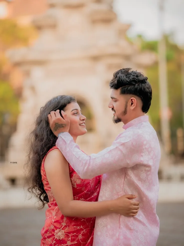 Candid Outdoor Pre-Wedding Portrait of Young Indian Couple at Historic Monument