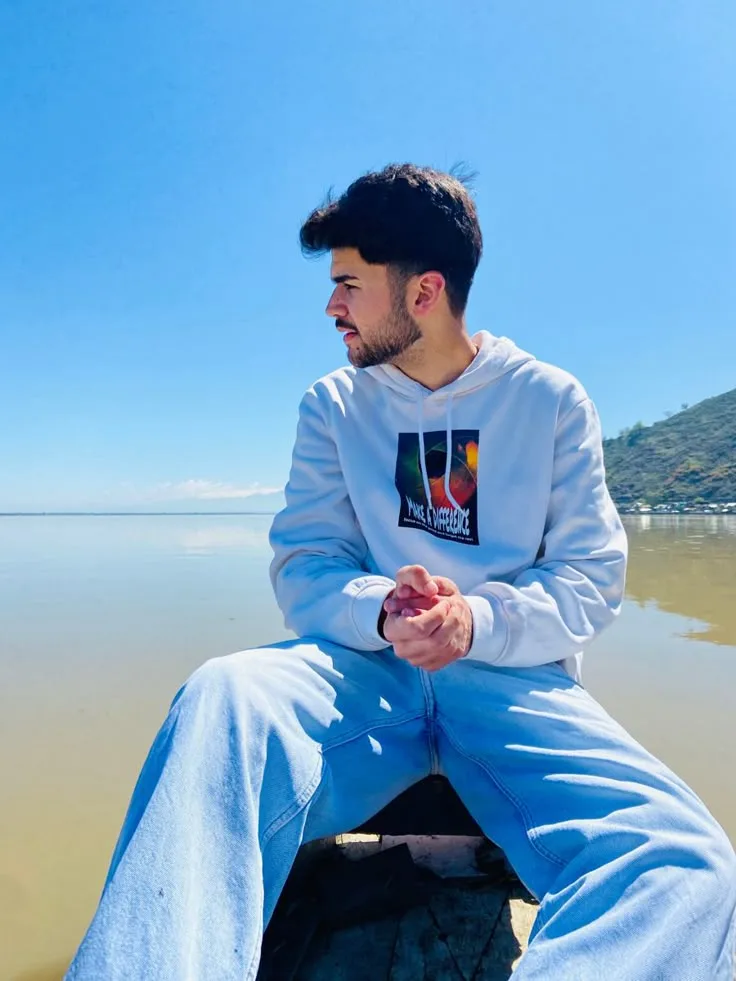 Candid Lakeside Boat Portrait of Young Man in Graphic White Hoodie