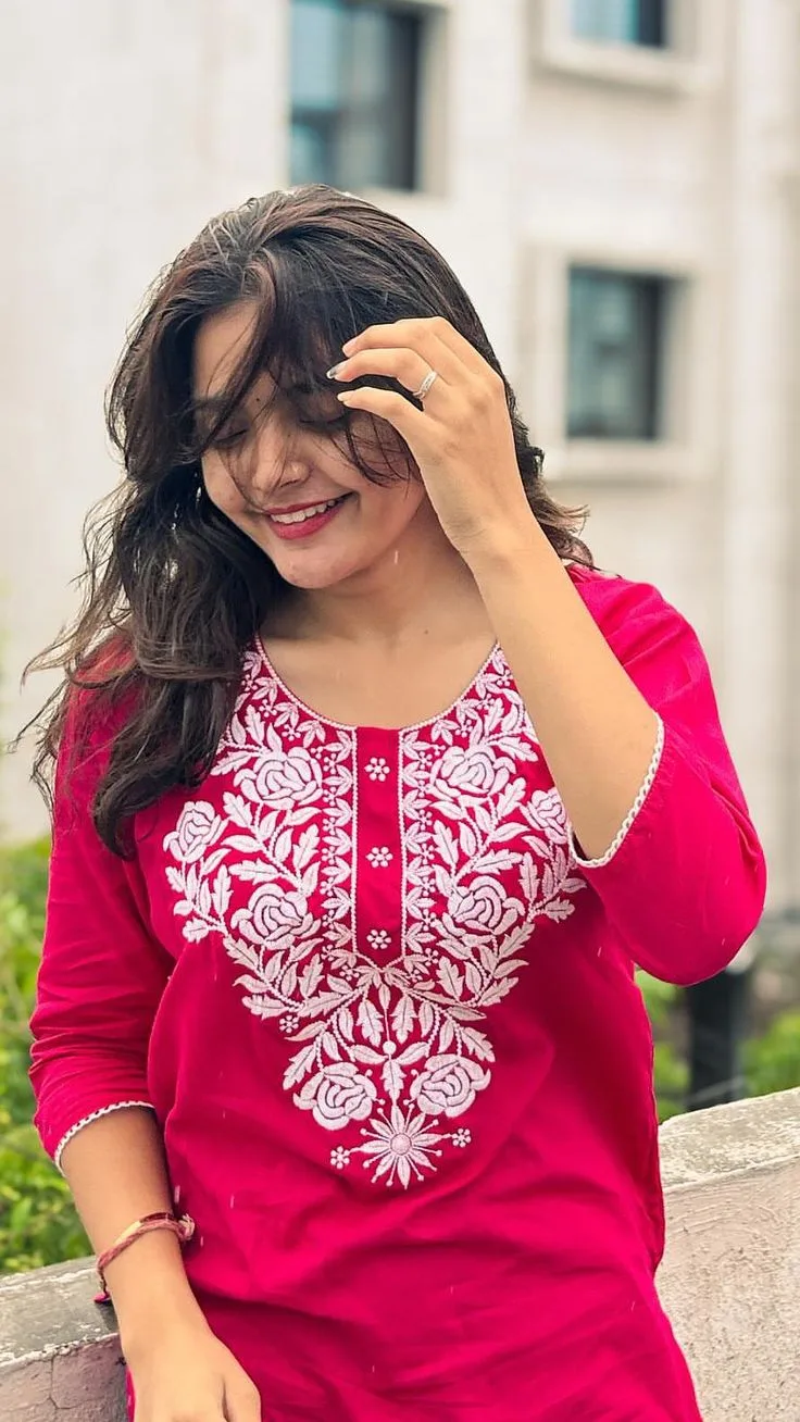 Candid Rooftop Portrait of Young Indian Woman in Pink Embroidered Kurti