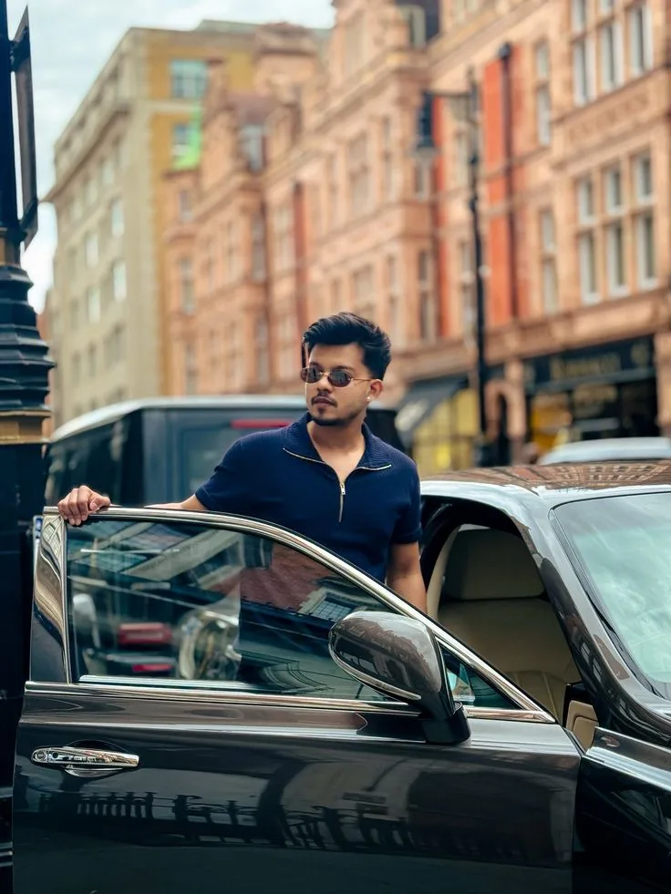 Candid Street Portrait of Young Man Stepping Out of Luxury Car