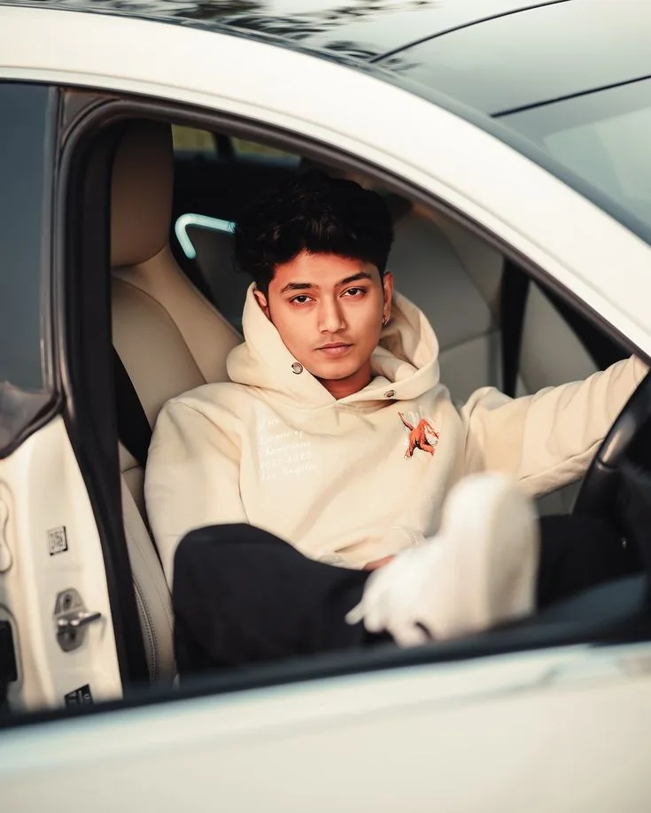 Candid Car Portrait of Young Man in Cream Hoodie