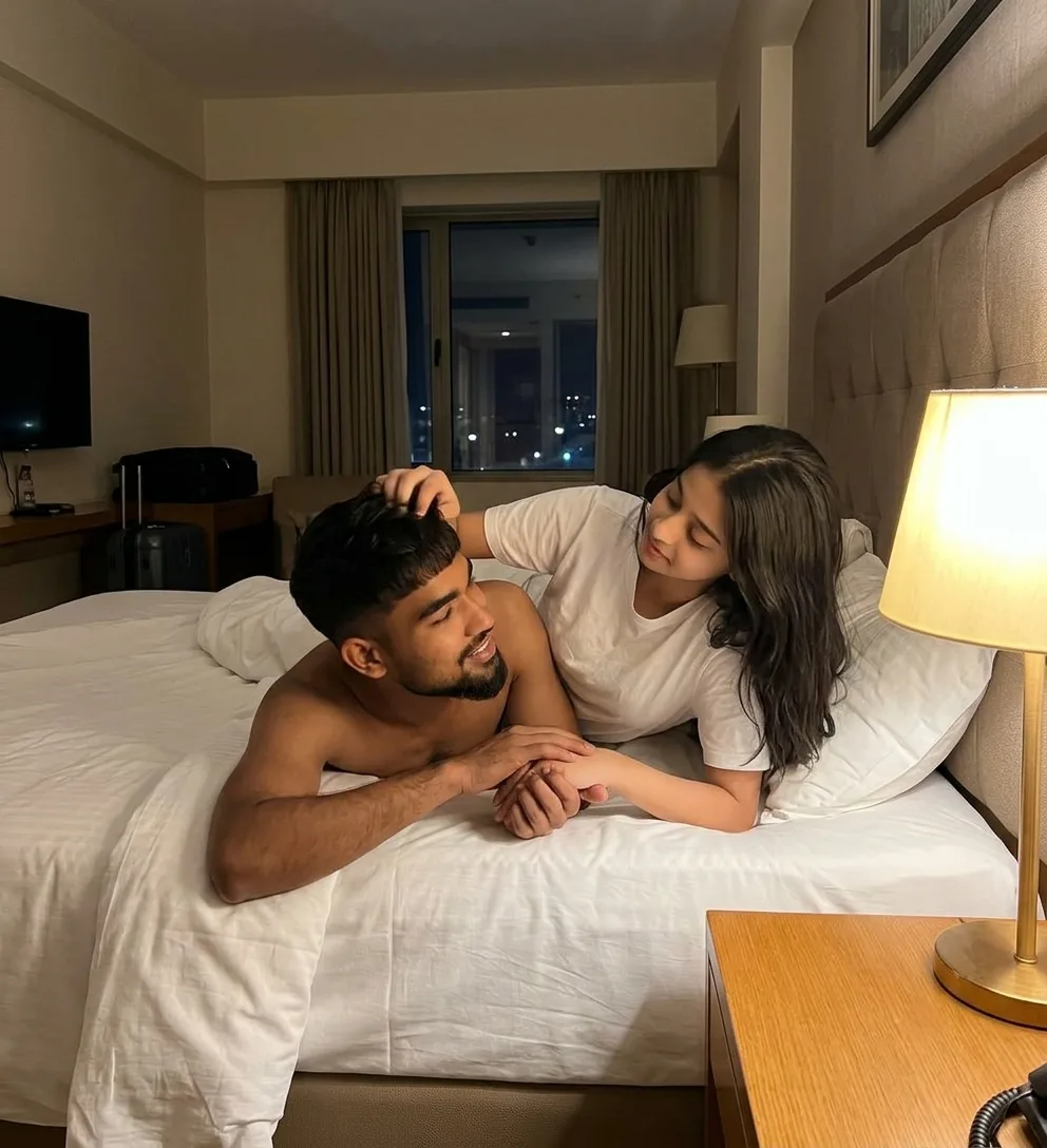 Candid Cozy Hotel Room Portrait of Young Couple on Bed