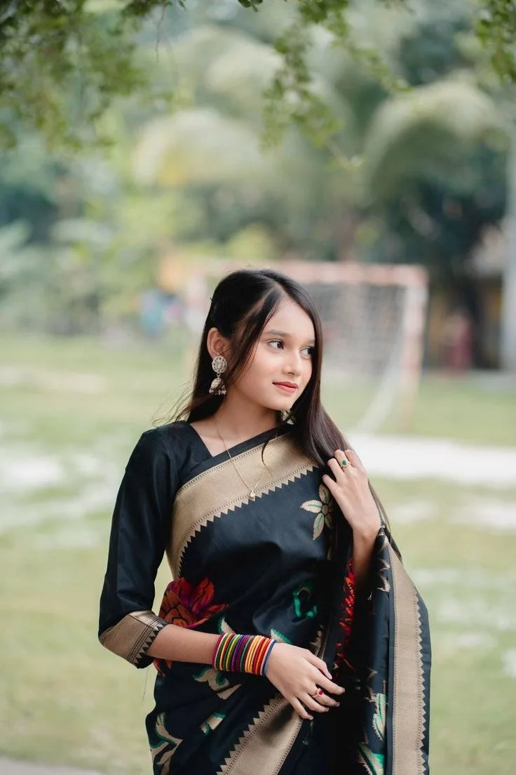 Candid Outdoor Portrait in Black and Gold Silk Saree