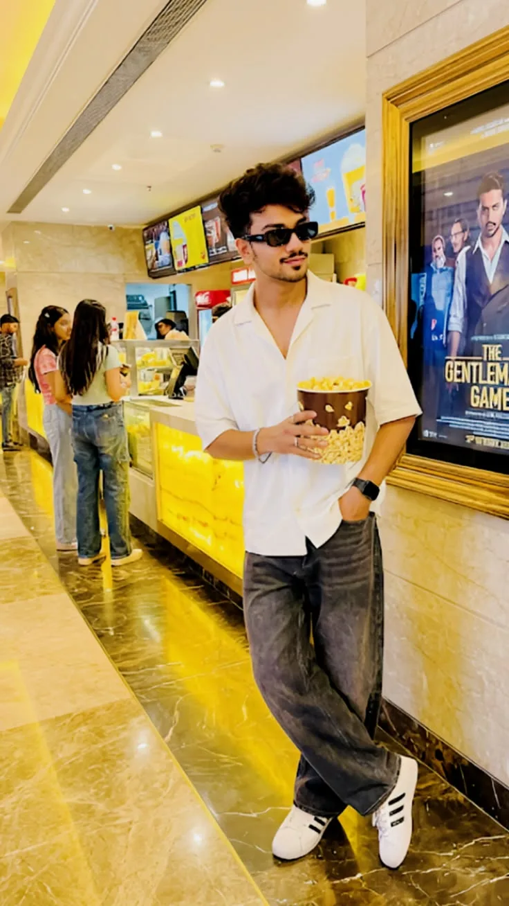 Casual Cinema Lobby Portrait of a Young Man with Popcorn