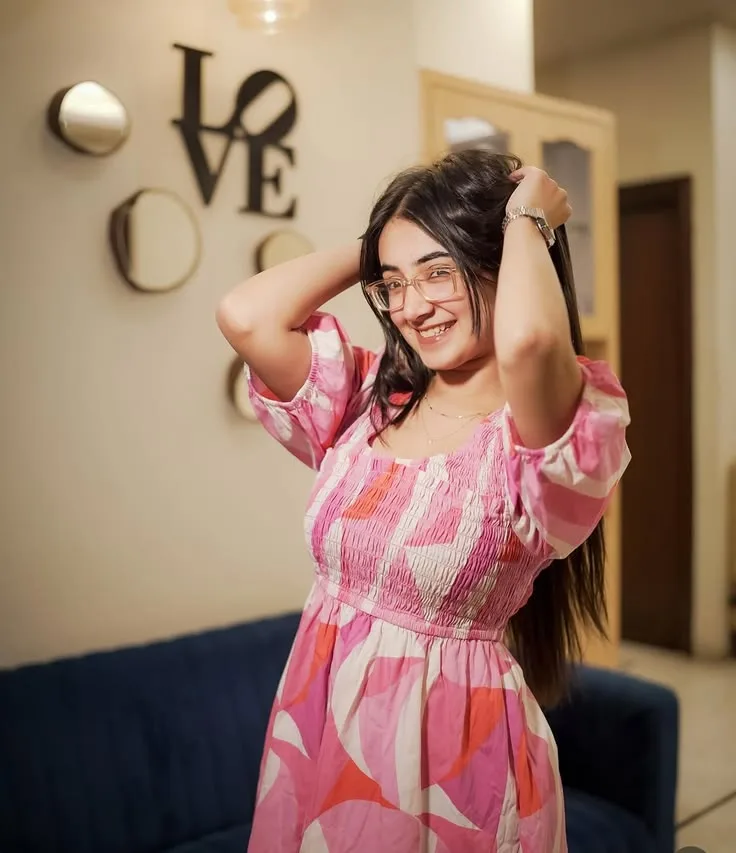 Candid Indoor Portrait of Young Woman in Pink Smocked Dress
