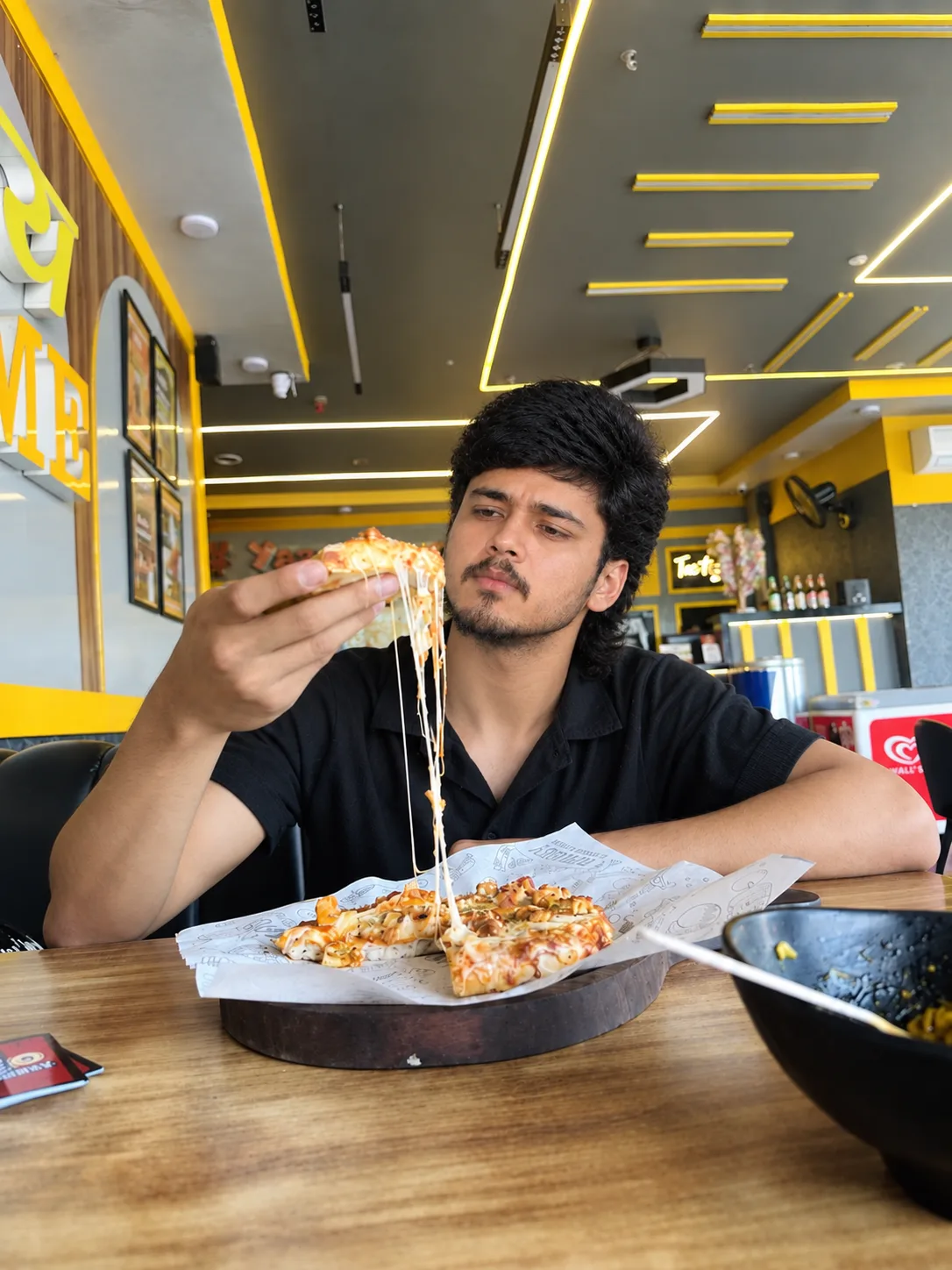 Cheesy Pizza Moment in a Modern Café