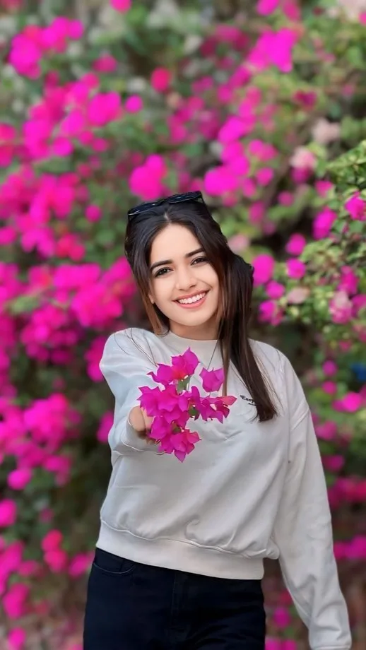 Candid Outdoor Portrait in Front of Blooming Bougainvillea