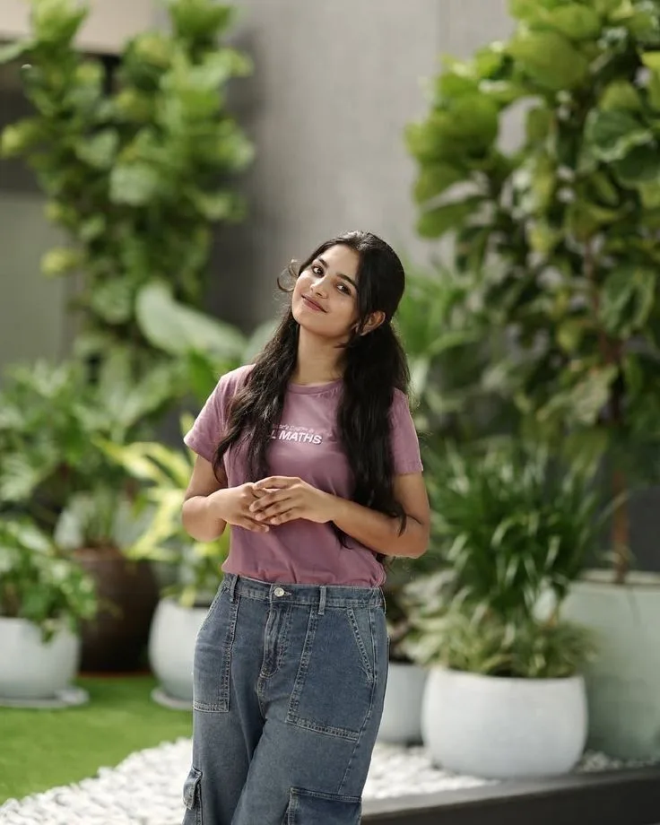 Candid Garden Portrait of Young Indian Woman in Mauve Tee and Baggy Jeans