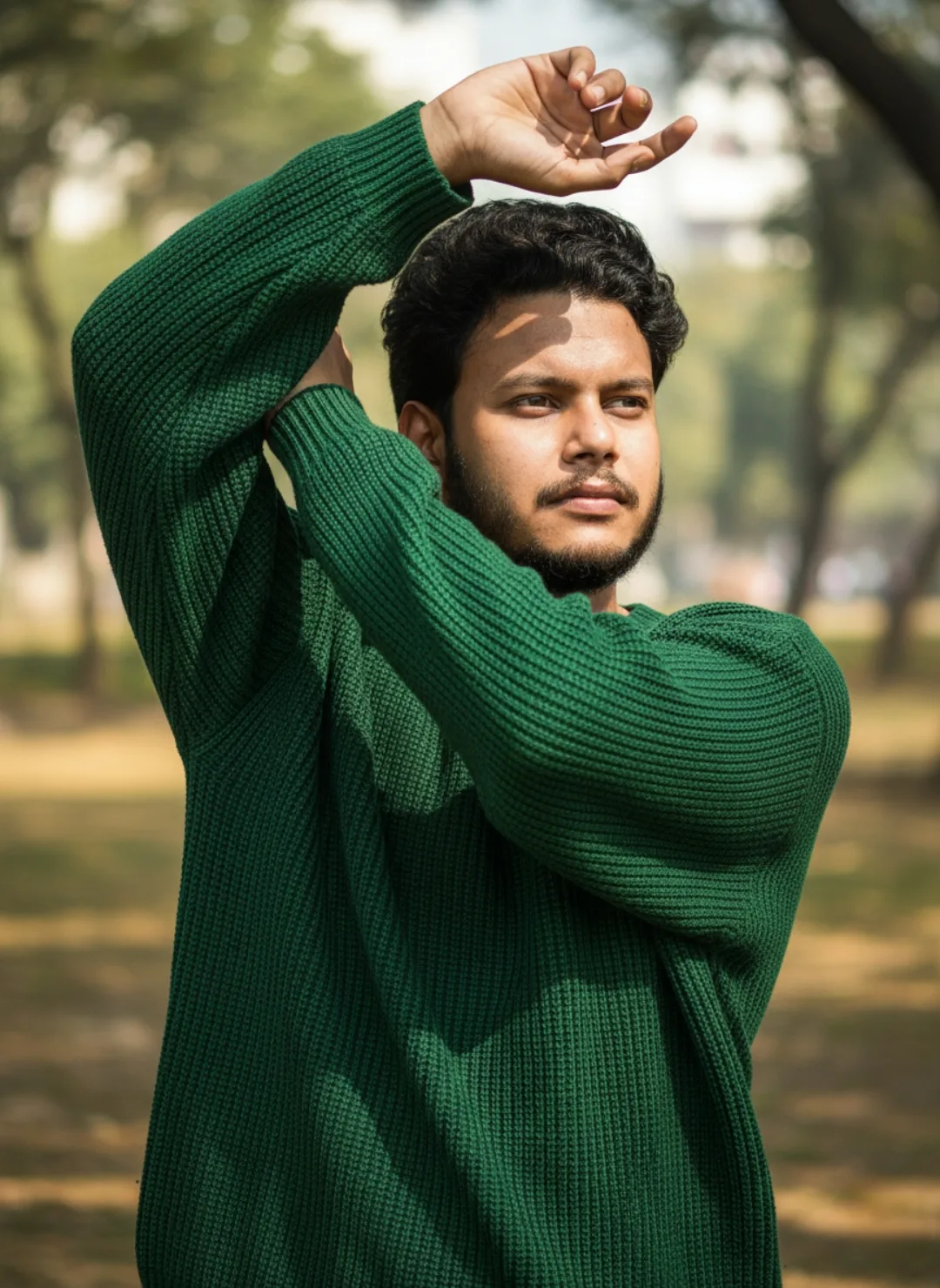 Confident Man in Green Waffle Sweater Outdoor Pose