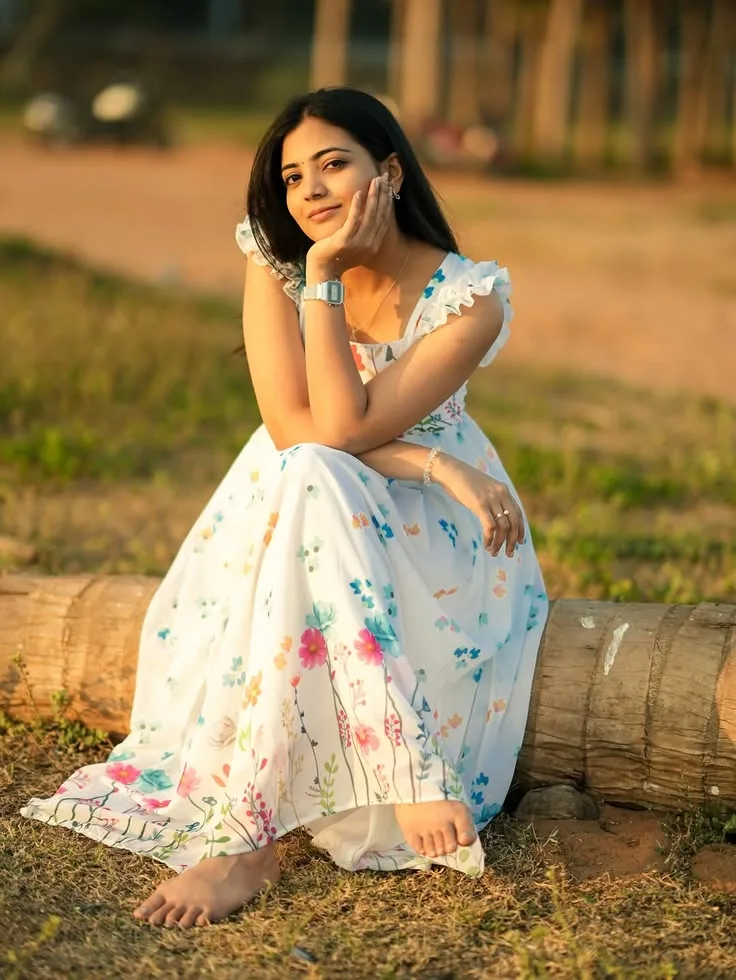Golden Hour Outdoor Portrait of Woman in White Floral Maxi Dress Sitting on Log Prompt
