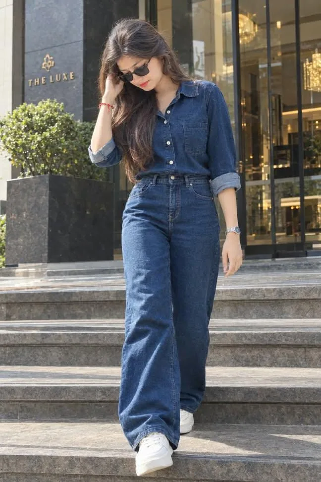 Stylish Woman Posing in Denim-on-Denim Outfit Outdoors