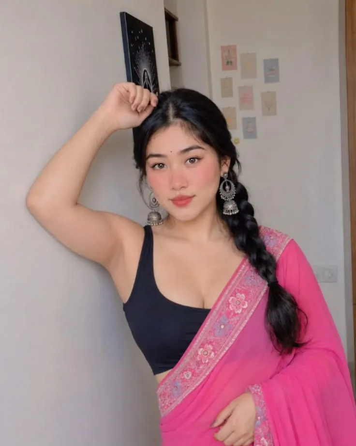 Indoor Portrait of Young Indian Woman in Pink Saree with Jhumkas