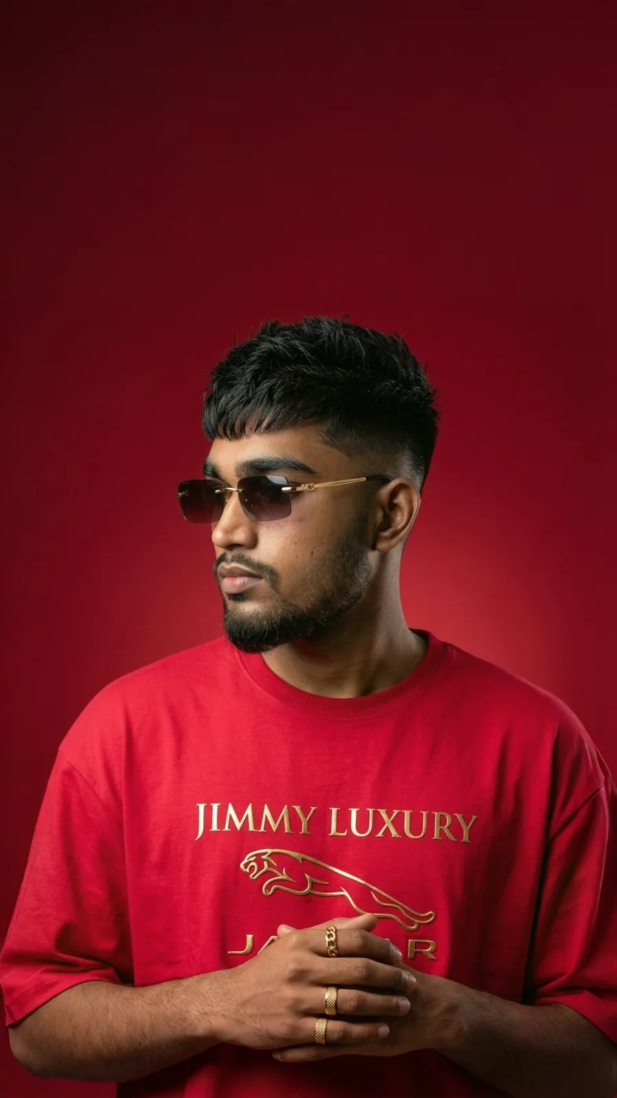 Studio Portrait of Young Indian Man in Red Oversized Tee