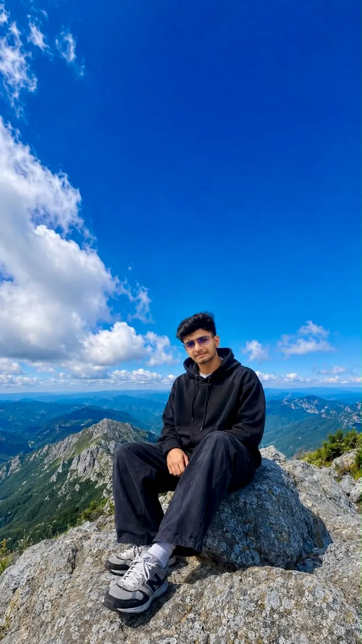 Candid Mountain Peak Portrait of Young Man in Black Streetwear