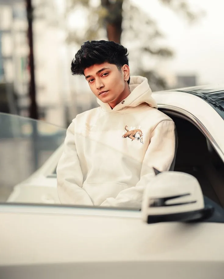 Candid Car Portrait of Young Man in Cream Hoodie
