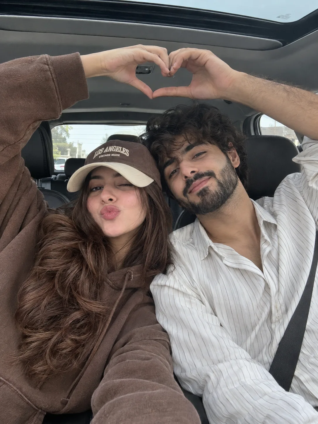Ultra realistic cinematic portrait of a young romantic couple in a car