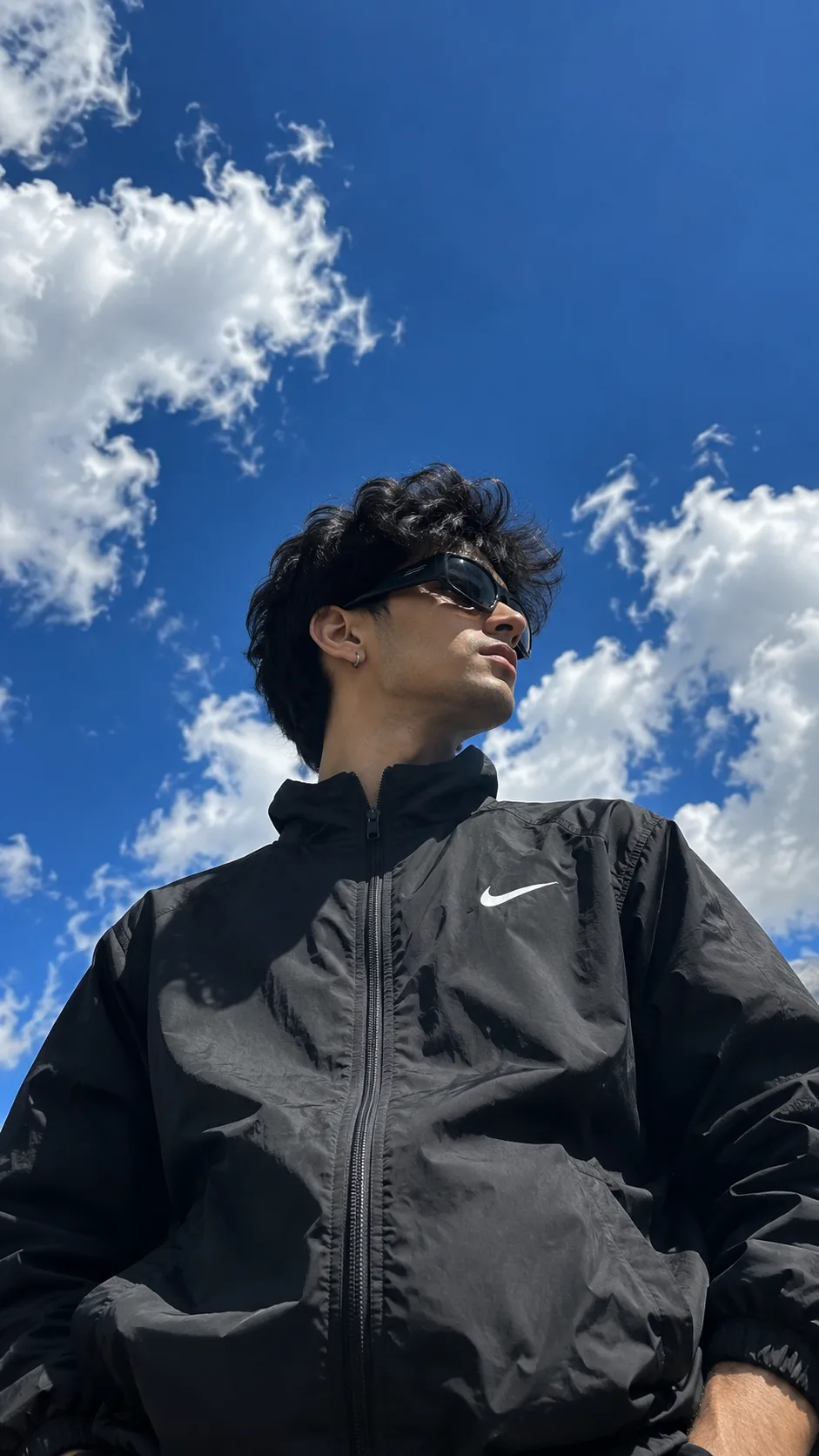 Ultra realistic low angle outdoor portrait of a young man
