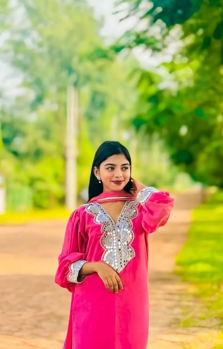 Candid Outdoor Portrait of Young Woman in Pink Mirror-Work Kurti