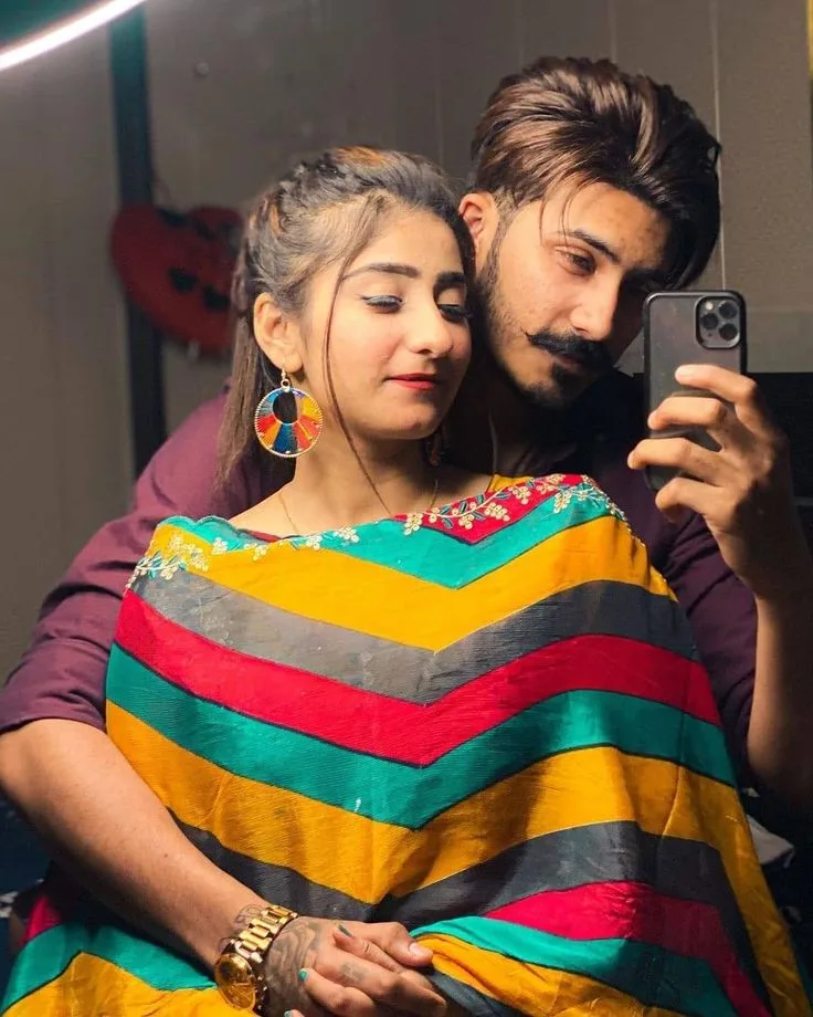 Intimate Indoor Mirror Selfie of Young Couple in Colorful Chevron Dupatta