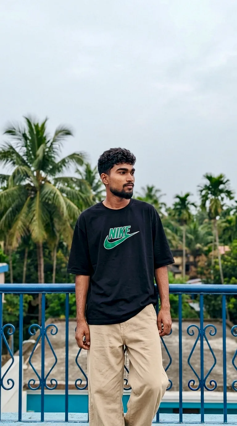 Candid Outdoor Streetwear Portrait of Young Man on Balcony
