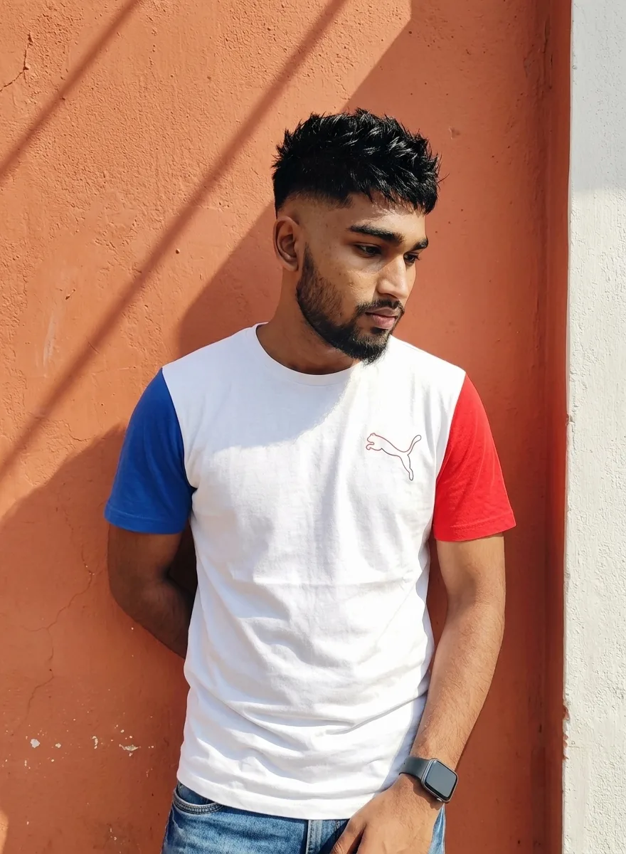Terracotta Wall Male Portrait in Color-Block Puma Tee with Hard Afternoon Shadows Prompt