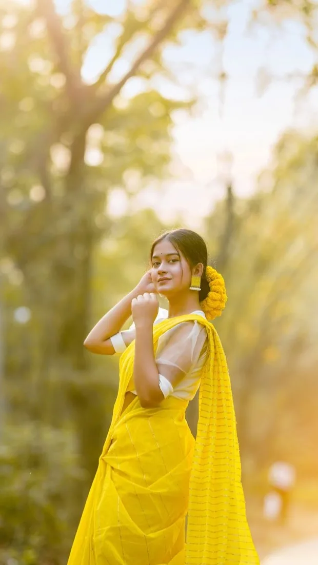 Golden Hour Outdoor Portrait of Indian Woman in Bright Yellow Saree