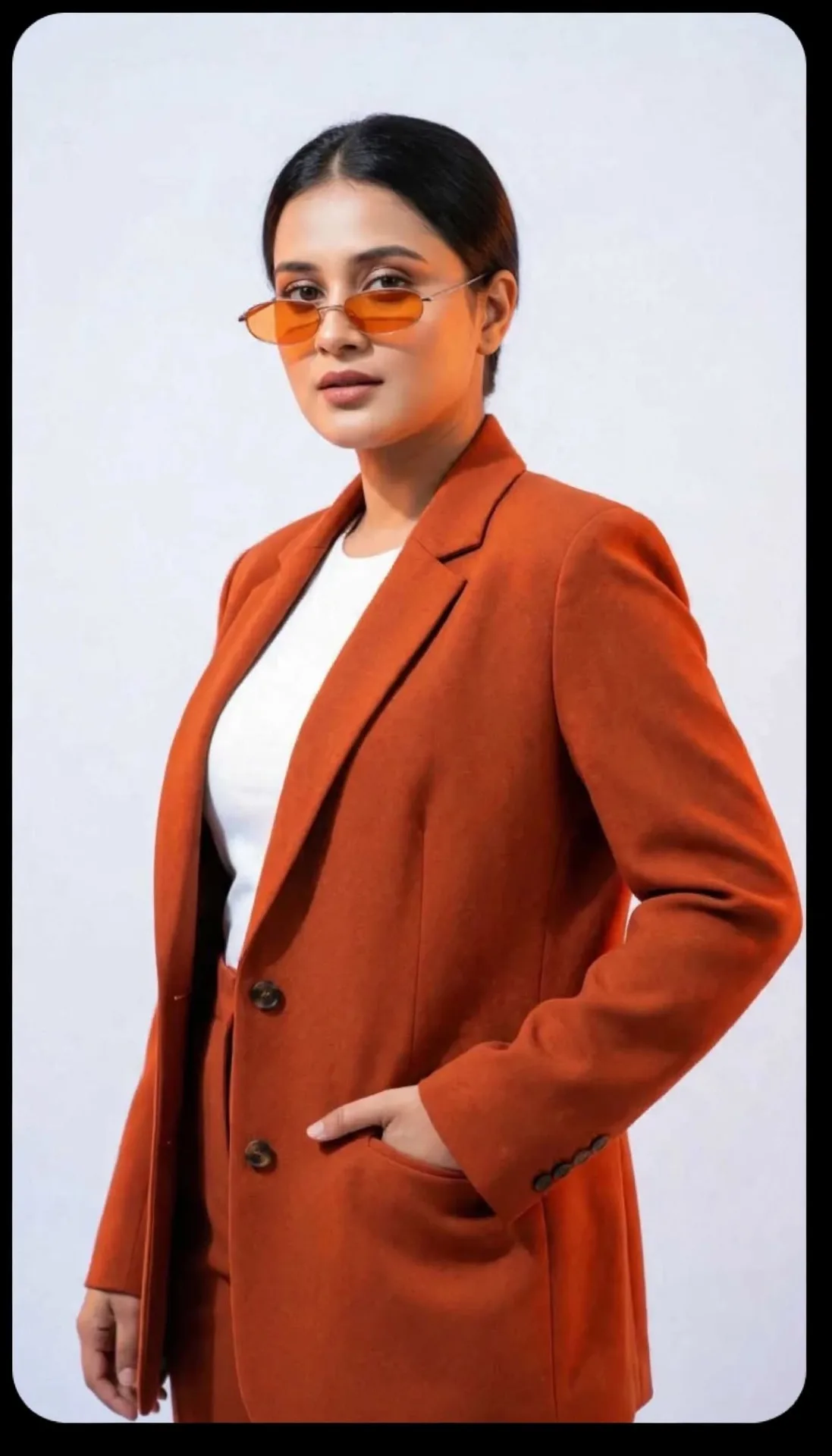 Confident Studio Portrait in Orange Blazer