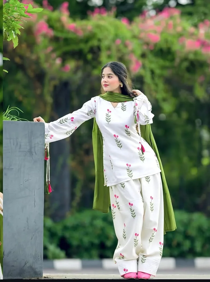 Candid Outdoor Portrait of Young Woman in White Floral Salwar Kameez