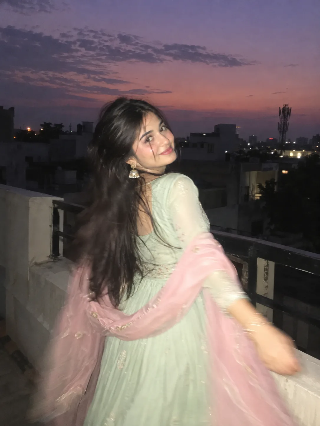 Ultra realistic candid rooftop portrait of a young woman