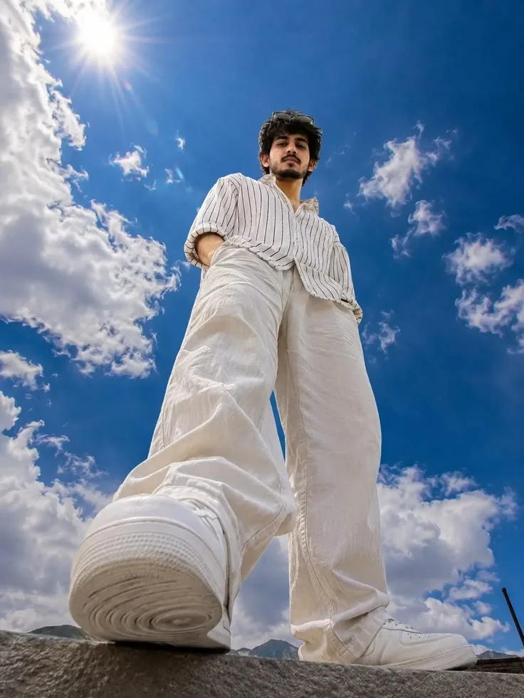Sky-High Low-Angle White Outfit Portrait
