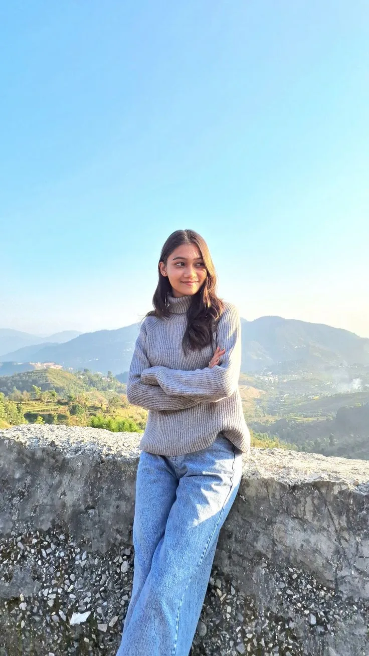 Candid Mountain View Portrait of Young Woman in Grey Turtleneck