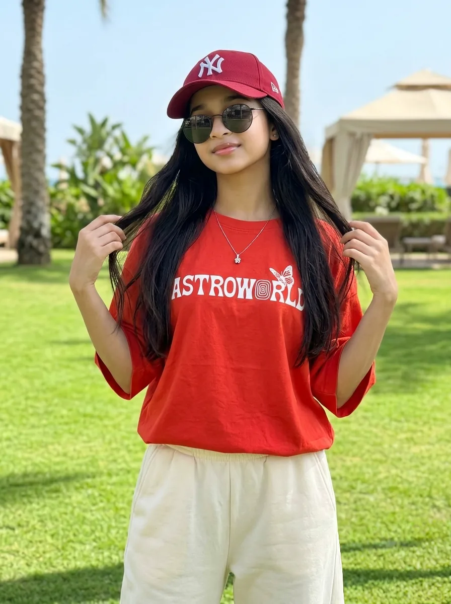 Streetwear Lifestyle Female Portrait in Red Astroworld Tee & NY Baseball Cap Prompt