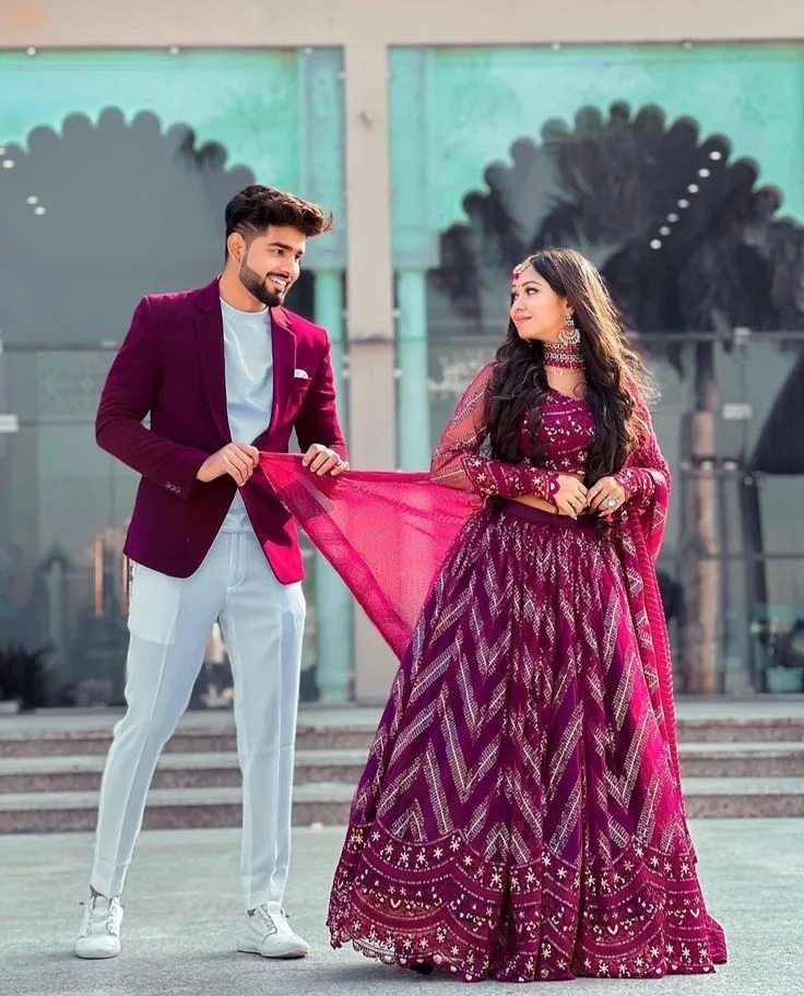 Romantic Candid Outdoor Portrait of Couple in Maroon Festive Wear