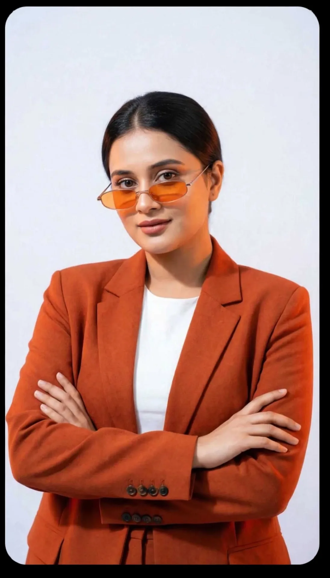 Confident Studio Portrait in Orange Blazer