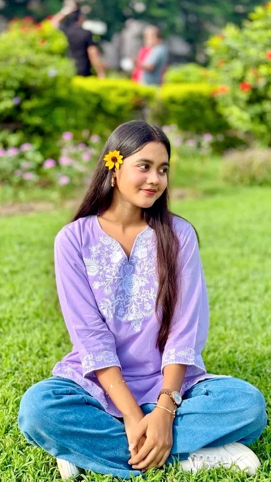 Candid Garden Lawn Portrait of Young Indian Woman in Lavender Kurti