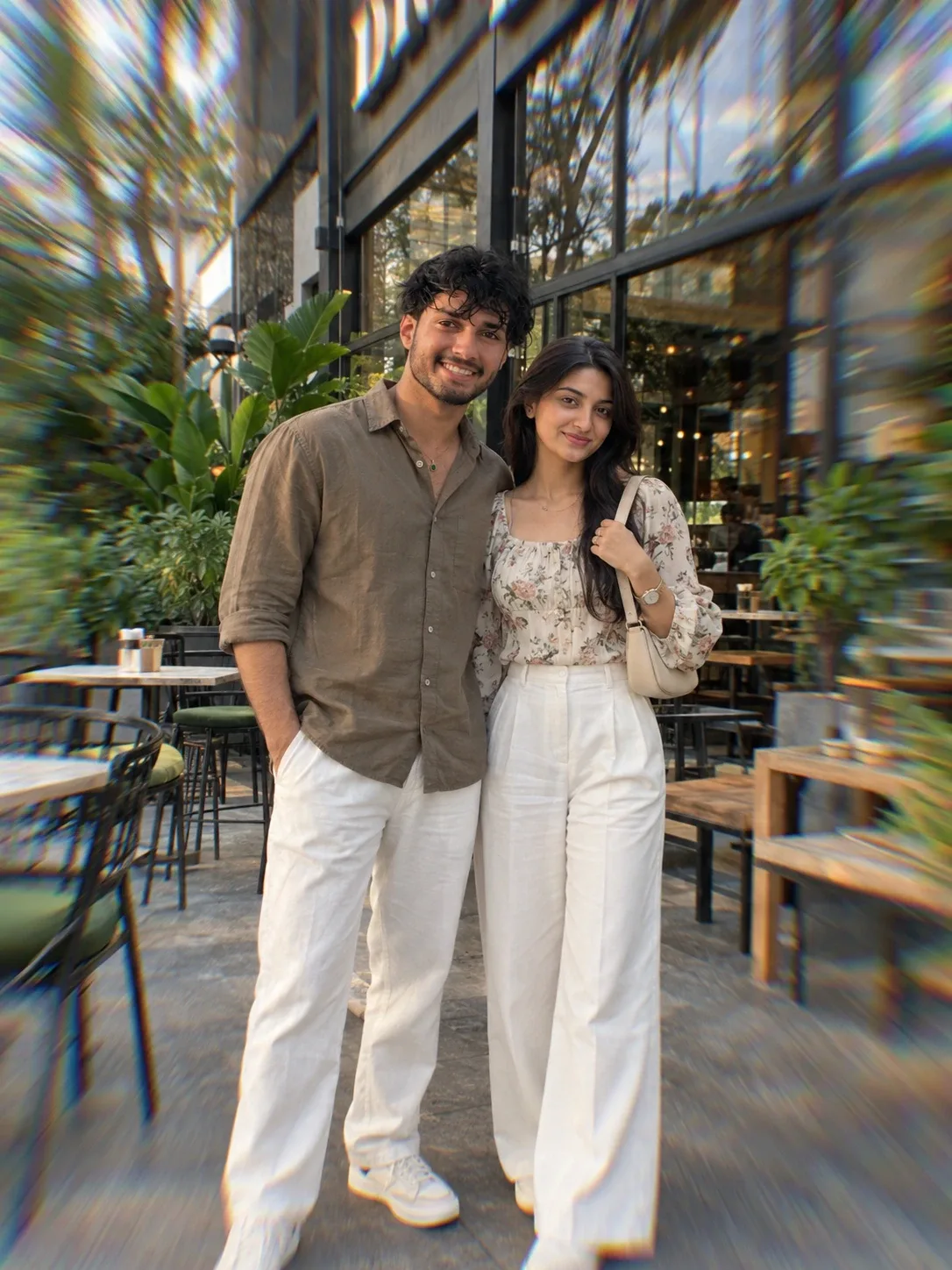 South Asian couple standing.