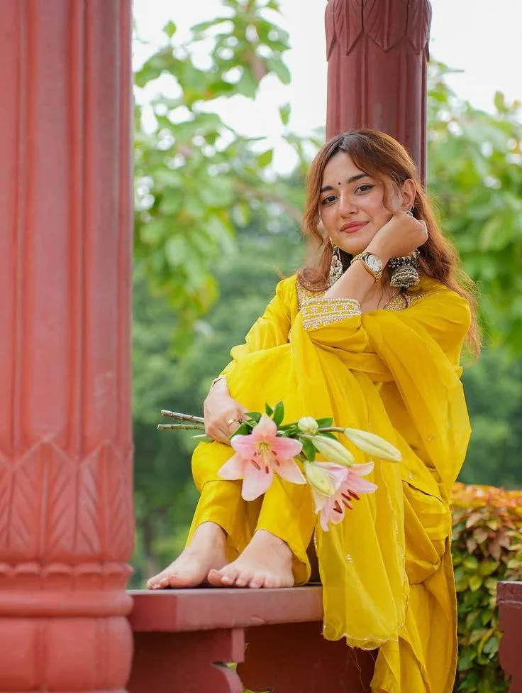 Woman in Yellow Traditional Dress with Lilies