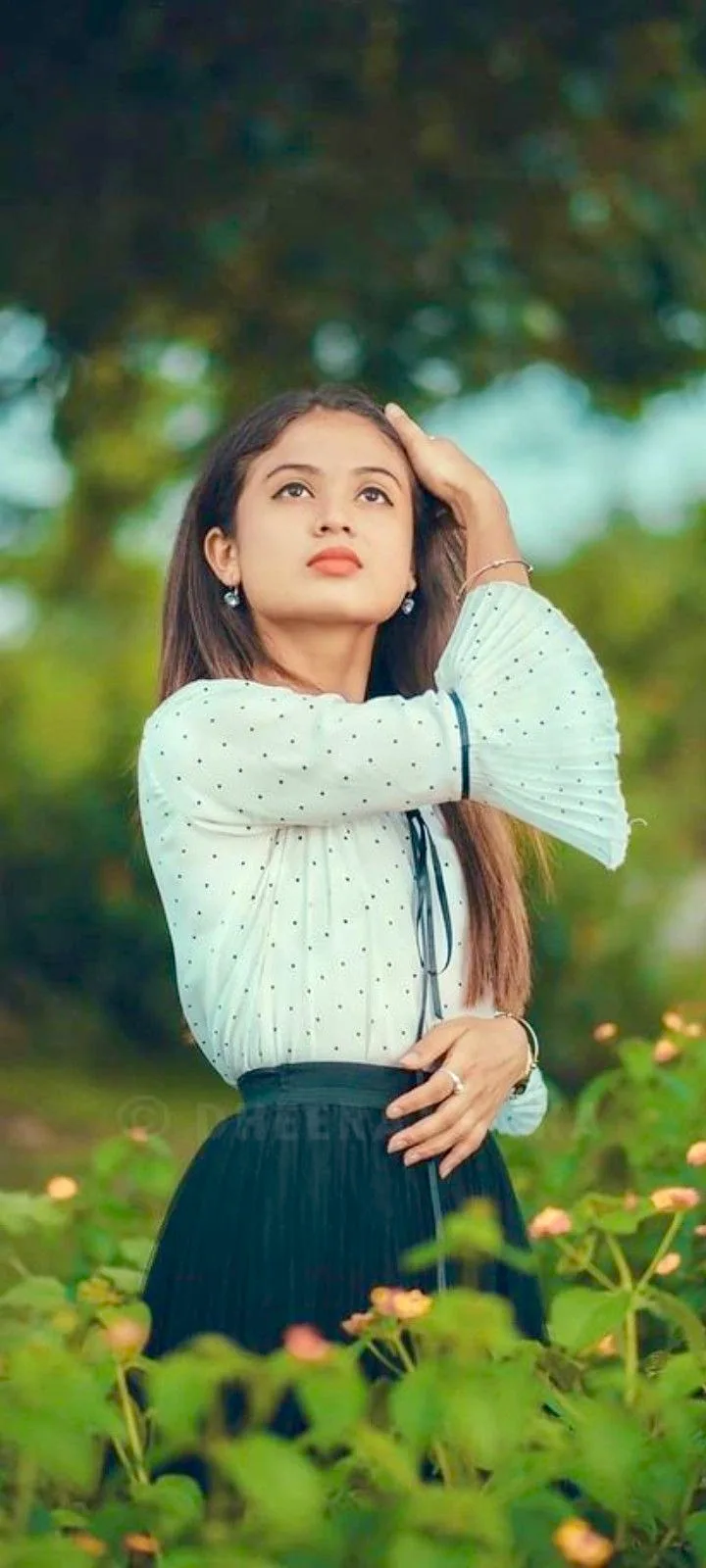 Candid Garden Portrait of Young Woman in Polka Dot Blouse