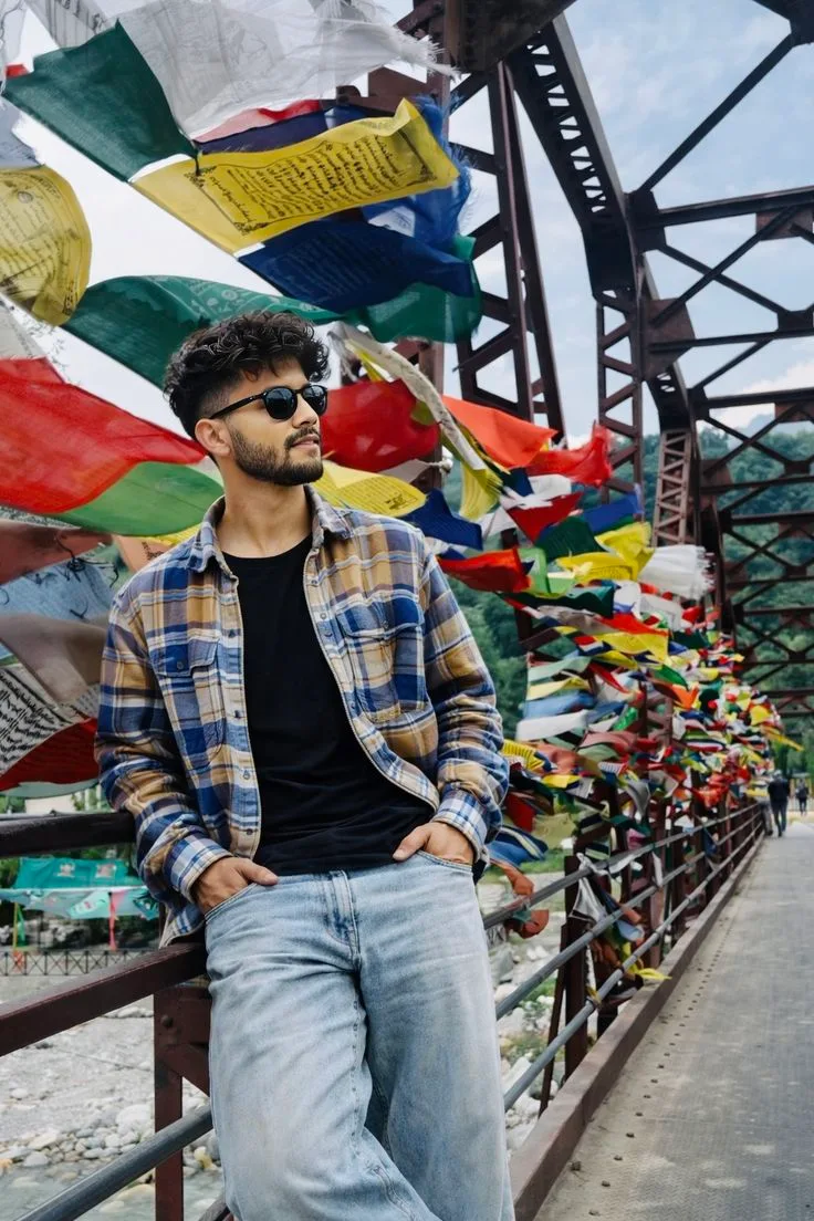 Candid Bridge Portrait of Young Man with Tibetan Prayer Flags