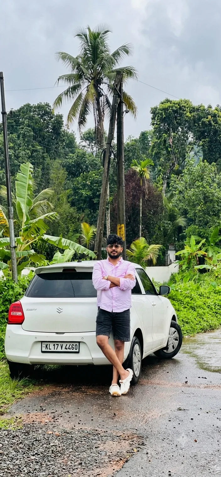 Candid Rainy Rural Portrait of Young Man Leaning on White Hatchback Car