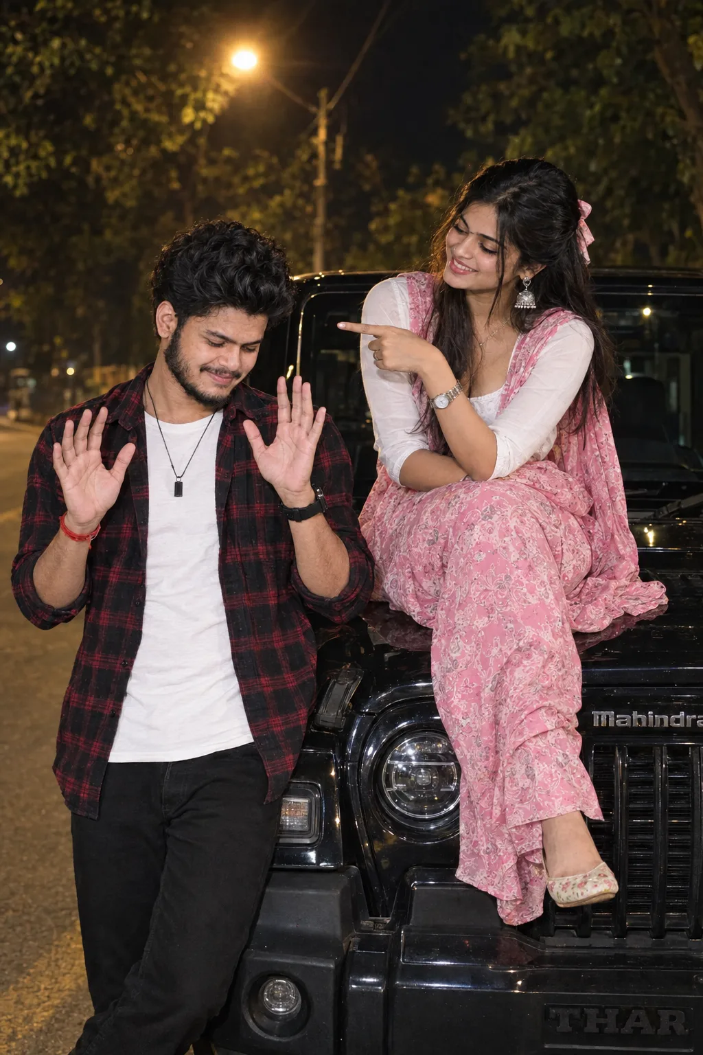 Playful Couple Posing with Mahindra Thar at Night