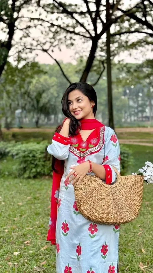 Candid Garden Portrait of a Young Woman in Floral Kurti