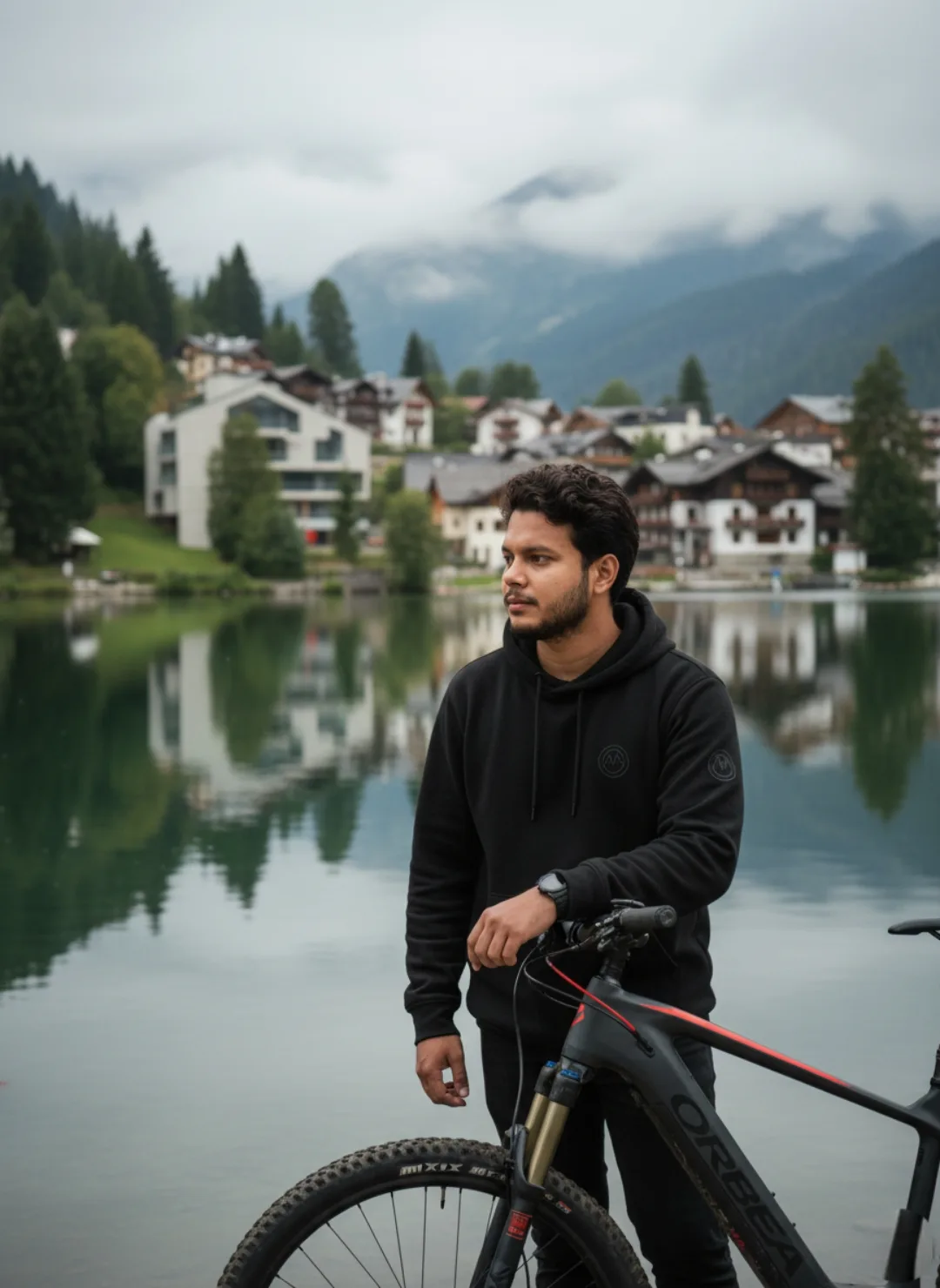 Serene Lakeside Reflection with Cyclist in Black Hoodie