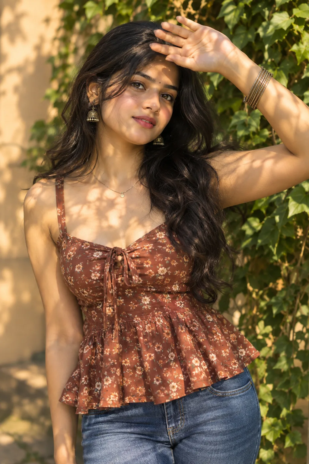 Golden Hour Elegance: A Beautiful South Asian Woman in a Floral Top Surrounded by Lush Greenery